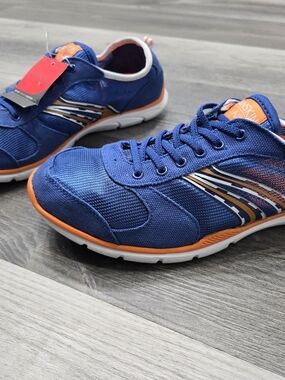 Danskin blue and orange  sneakers are designed for athletic activities.